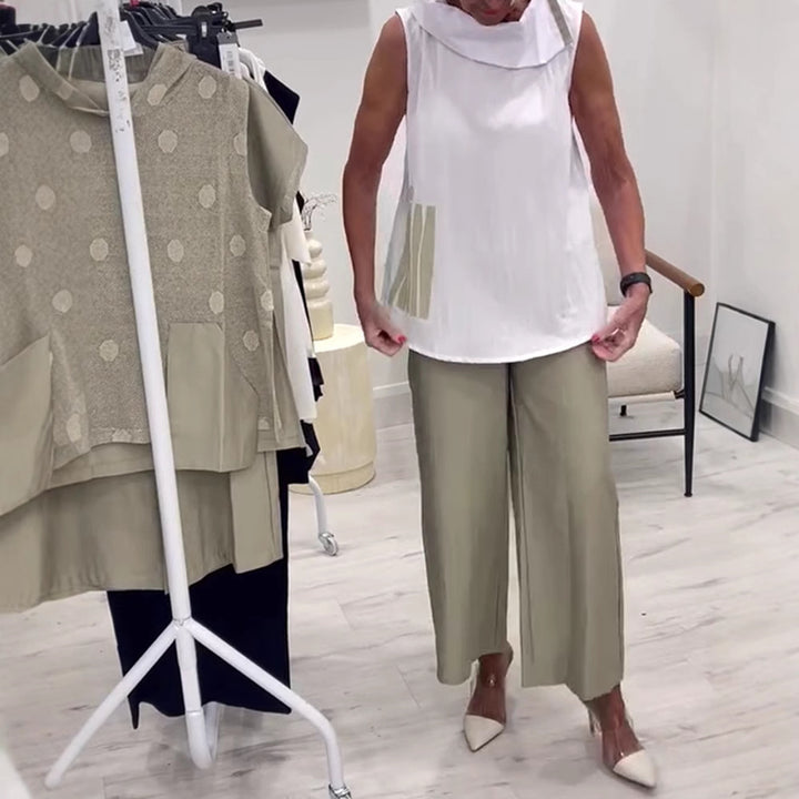 Women's sleeveless blouse top with wide shawl collar, relaxed A-line and side decorative yoke Mune Fashion