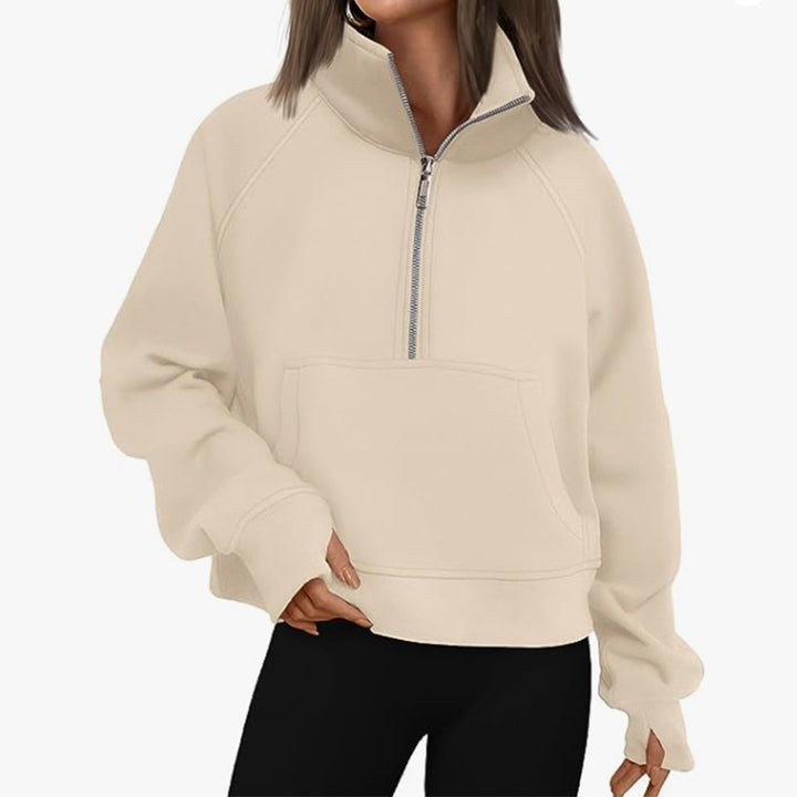 Women’s oversized half-zip sweater with kangaroo pocket, thumb holes, and high collar Mune Fashion