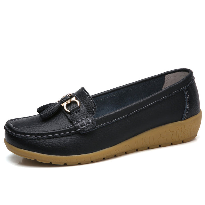 Women's classic tassel moccasin made of textured synthetic leather with padded comfort insole and flexible wedge sole Mune Fashion