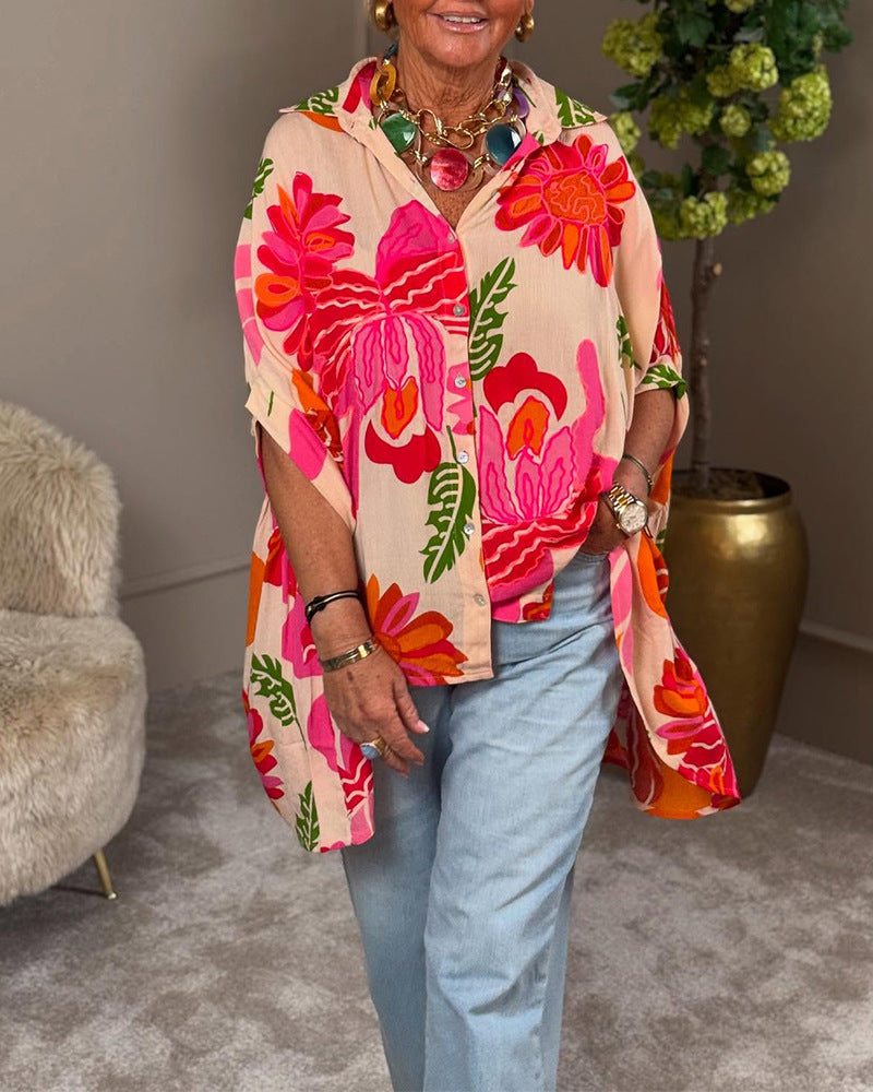 Women's airy oversized resort-style shirt blouse with large floral print and asymmetrical scalloped hem Mune Fashion