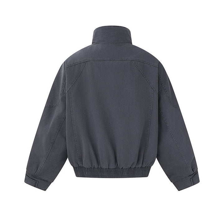 Men's short-cut canvas bomber jacket with high stand-up collar, concealed front placket, and zip pockets Mune Fashion