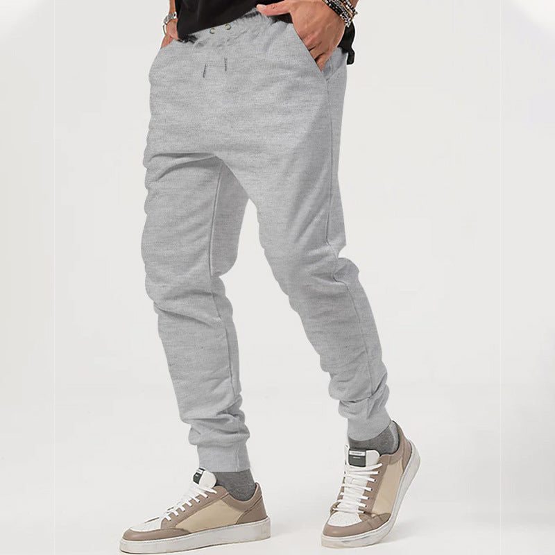 Men's nan tapered jogging pants with elastic drawstring waistband, practical side pockets, and narrow cuff hem Mune Fashion