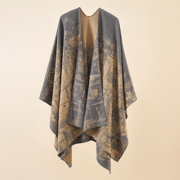Women's wool blend cape with graphic jacquard, open kimono fall, and soft draping.