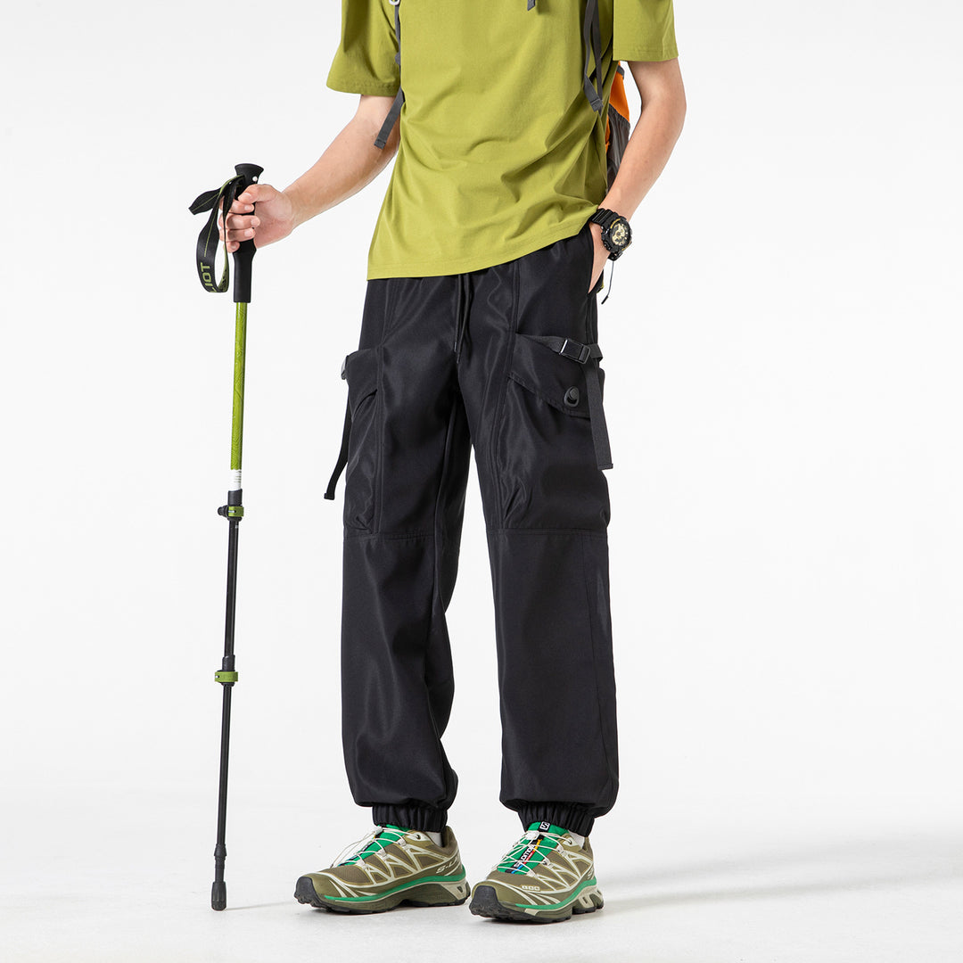 Unisex Wide Technical CargoJogging Pants with adjustable drawstring, large flap pockets, and elastic ankle cuffs Drune