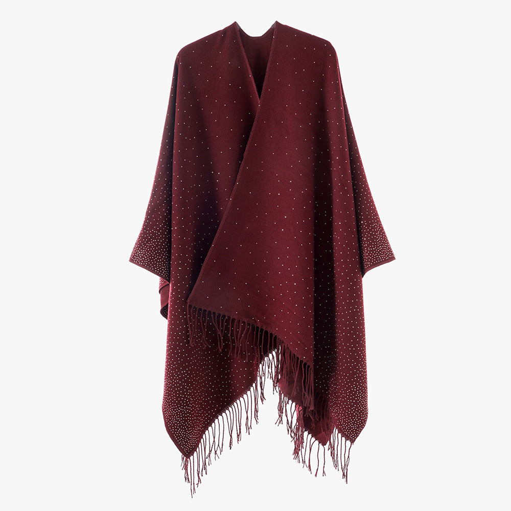 Women’s knitted poncho with fringes and subtle shimmer embellishment Mune Fashion