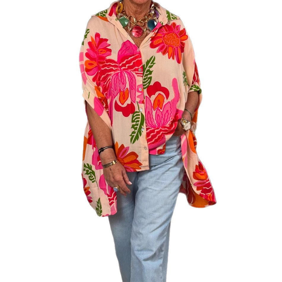 Women's airy oversized resort-style shirt blouse with large floral print and asymmetrical scalloped hem Mune Fashion