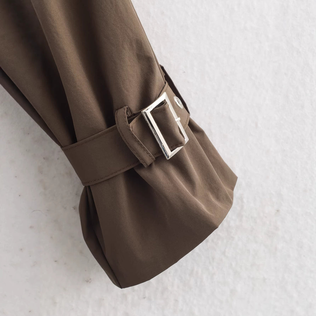 Women's short trench coat with high standing collar, double snap button placket and waist belt Mune Fashion