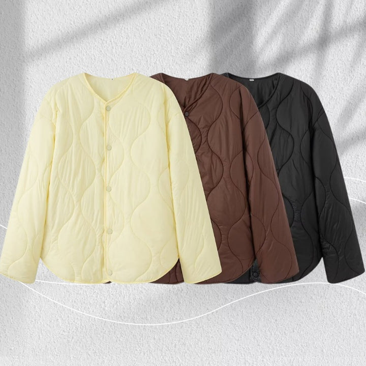 Women's quilted jacket with oversized cut, round neck and curved hem Mune Fashion