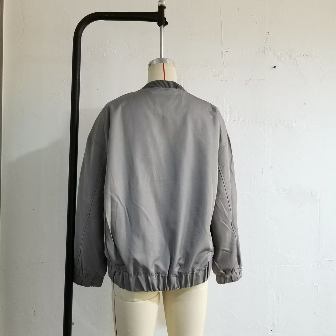 Unisex nan lighter oversized bomber jacket with continuous metal zipper, ribbed collar, and elastic hem Mune Fashion