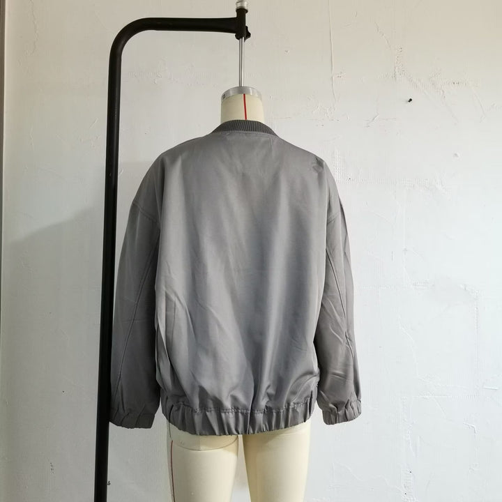 Unisex nan lighter oversized bomber jacket with continuous metal zipper, ribbed collar, and elastic hem Mune Fashion