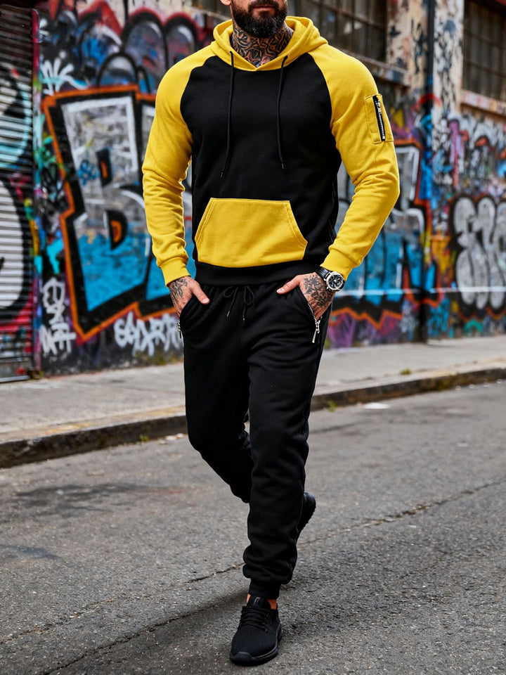 Men's two-piece hooded sweat set with raglan sleeves, sleeve zip pocket, and tapered jogging pants Mune Fashion