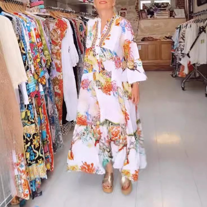 Women's airy maxi dress in layered look with V-neck, button placket, and three-quarter bell sleeves Mune Fashion
