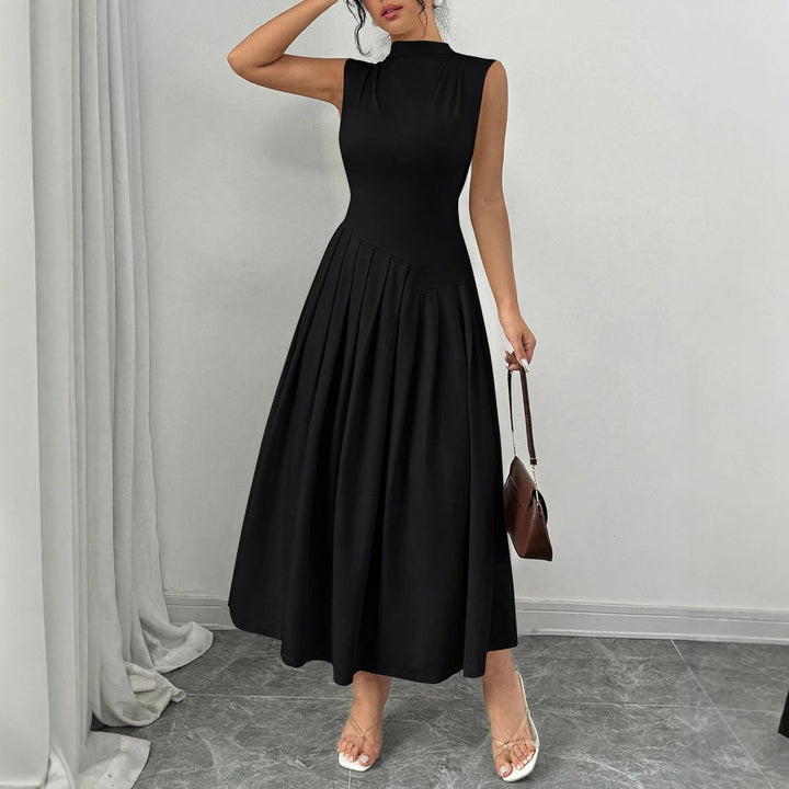 Women's sleeveless maxi dress with high standing collar, fitted bodice, and pleated skirt Mune Fashion