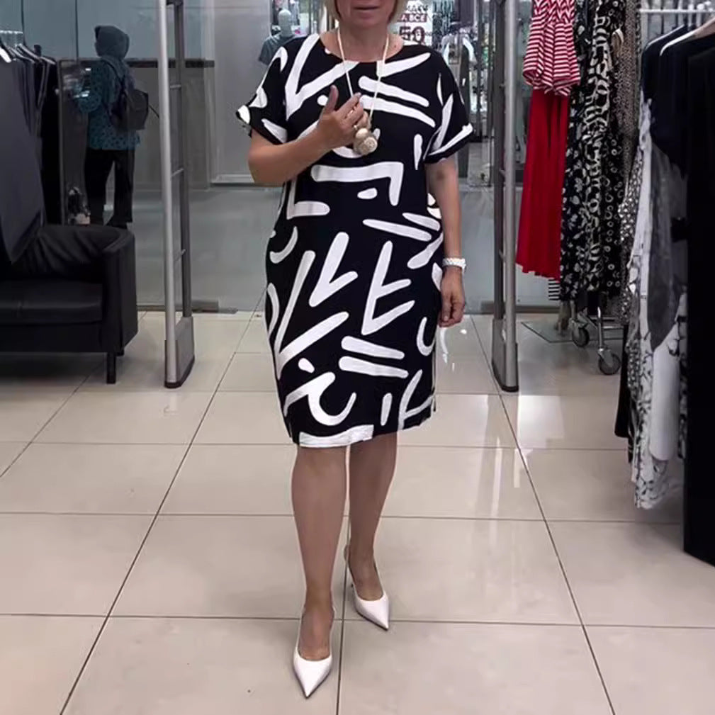 Women knee-length comfort shift dress with large brush stroke print and rolled short sleeves Mune Fashion
