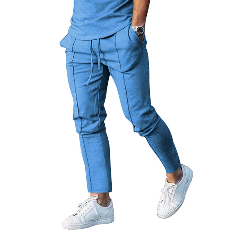 Men's Slim Tapered Jogging Pants with decorative stitching, elastic drawstring, and narrow ankle cuffs Mune Fashion