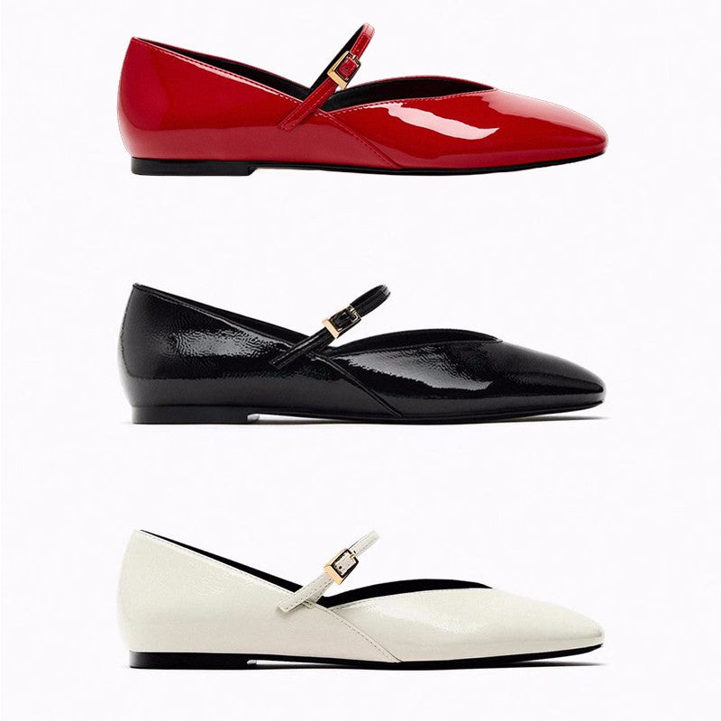 Women's elegant patent leather Mary Jane ballerina flats with a fine metal buckle and pointed toe cap.