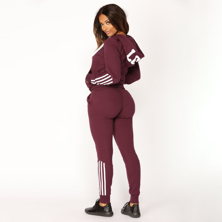 Women's sporty zip hoodie and slim jogger set made of French terry with contrasting stripes Mune Fashion