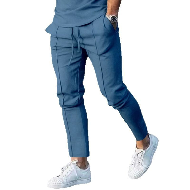 Men's Slim Tapered Jogging Pants with decorative stitching, elastic drawstring, and narrow ankle cuffs Mune Fashion