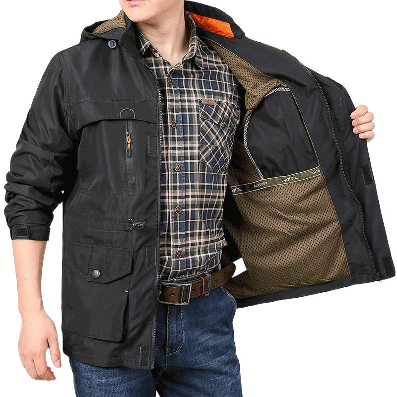 Men's lightweight windproof field jacket with breathable mesh inner lining, numerous zipper and flap pockets, as well as adjustable sleeve cuffs.