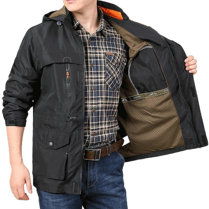 Men's lightweight windproof field jacket with breathable mesh inner lining, numerous zipper and flap pockets, as well as adjustable sleeve cuffs.