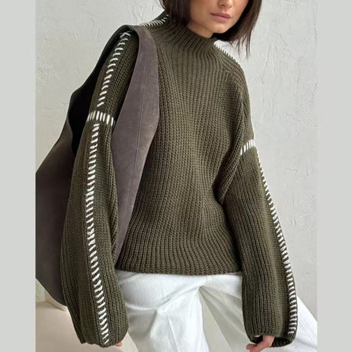 Women's chunky knit oversized sweater with high roll neck edge and decorative stitch sleeves Mune Fashion
