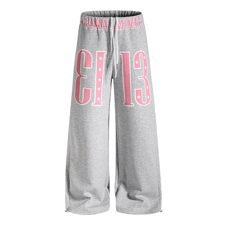 Women's Wide Palazzo Jogging Pants with High Comfort Waistband, Drawstring and Large Graphic Front Mune Fashion