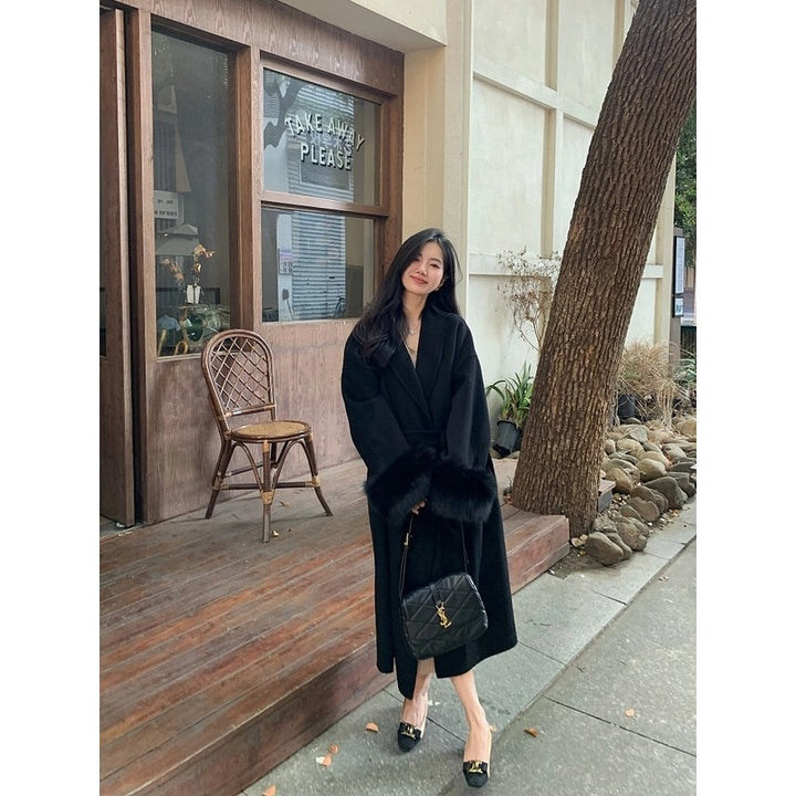 Women's Long Wool Blend Coat with Waist Belt and Voluminous Fur Trim at Sleeve Ends Mune Fashion