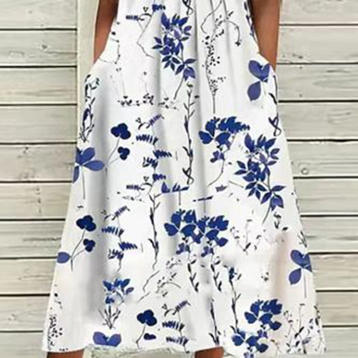 Ladies' airy A-line midi dress with lace sleeves, side pockets, and round neckline Mune Fashion