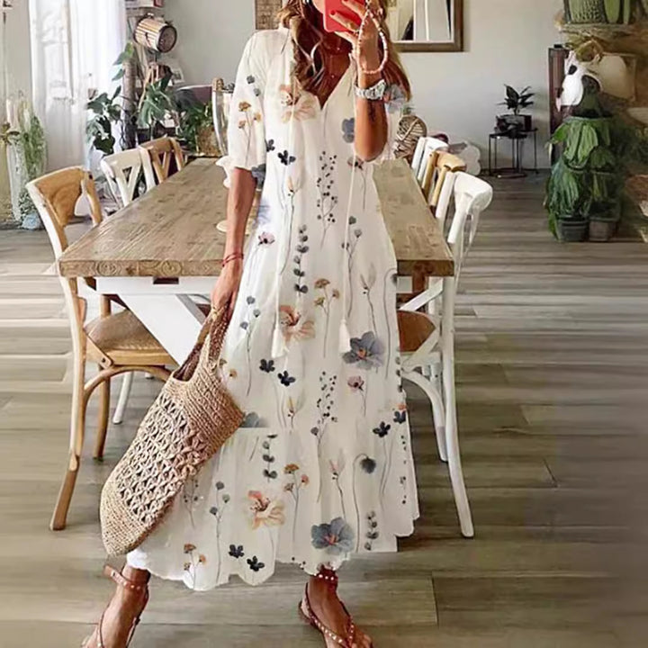 Women’s airy maxi dress in A-line with V-neck, casual rolled sleeves and floral all-over print Mune Fashion
