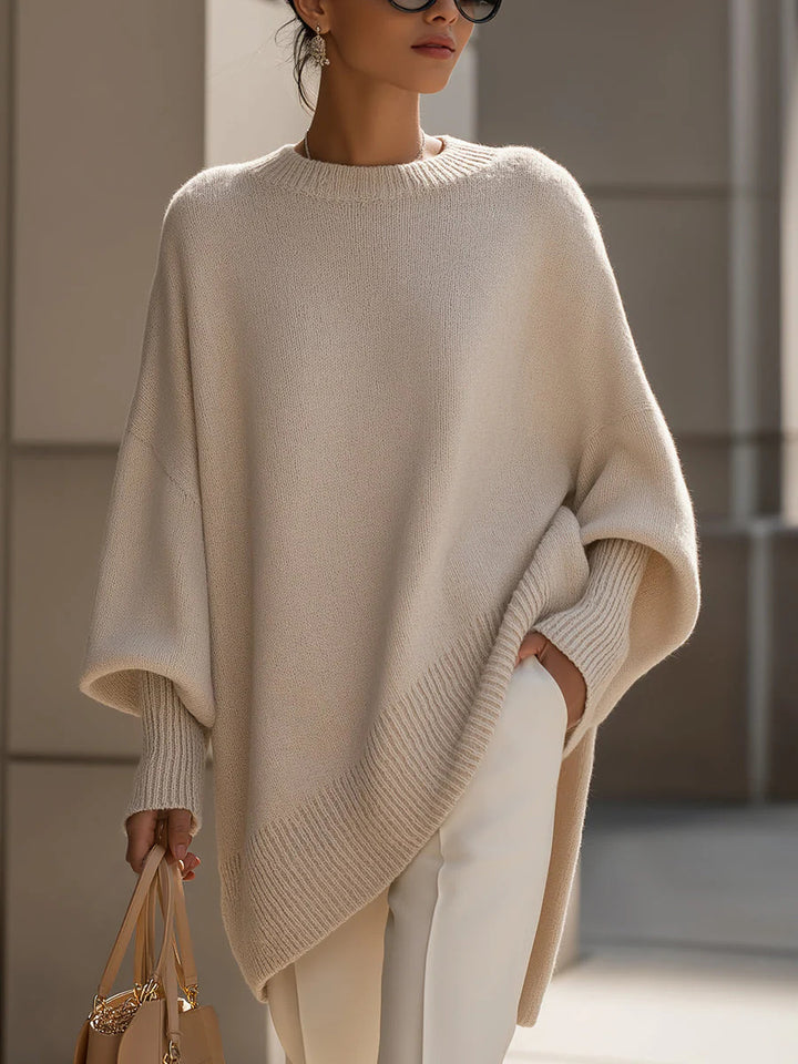 Women's oversized knit poncho with asymmetrical hem and ribbed sleeves Mune Fashion