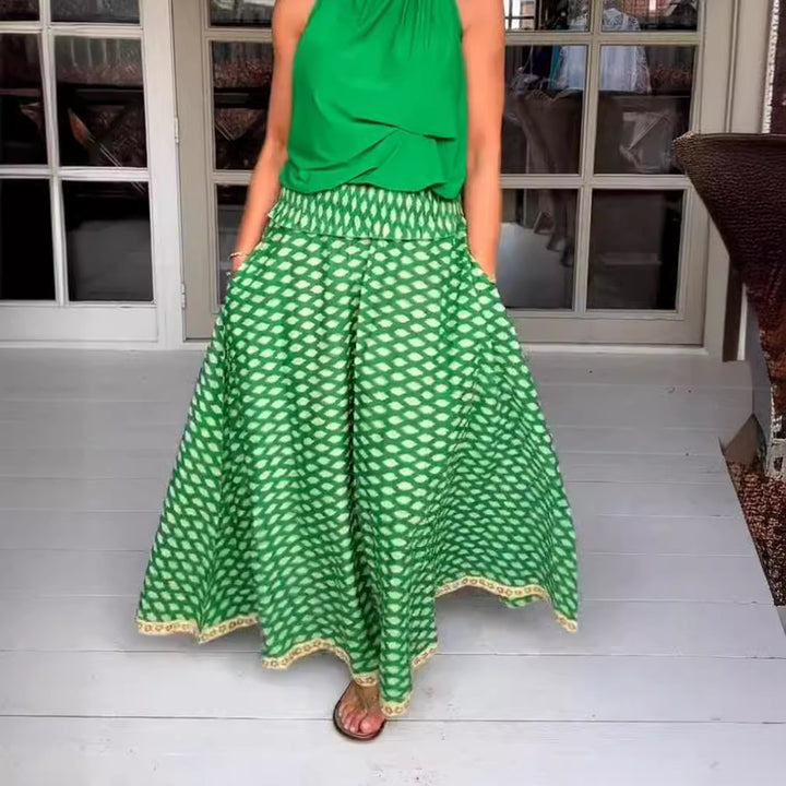 Women's two-piece halter neck set with gathered stand collar and patterned maxi skirt with elastic smocked waistband Mune Fashion