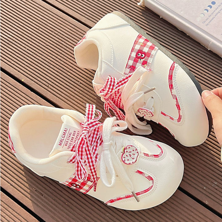 Women's sneakers with playful check pattern and decorative bows Mune Fashion