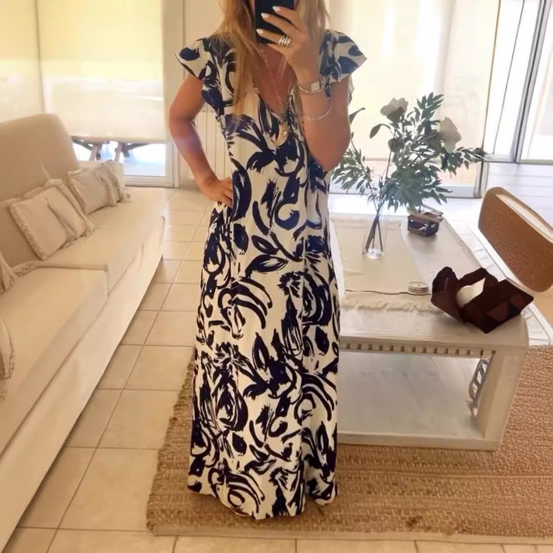 Women's flowing maxi dress with V-neck, flutter sleeves, and side leg slit Mune Fashion