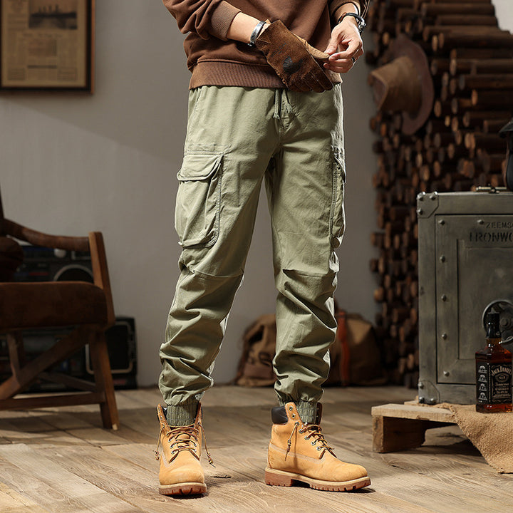 Herren Konisch geschnittene Utility-Cargo-Jogginghose mit Tunnelzugbund, Klapptaschen und Knöchelreißverschlüssen Mune Fashion