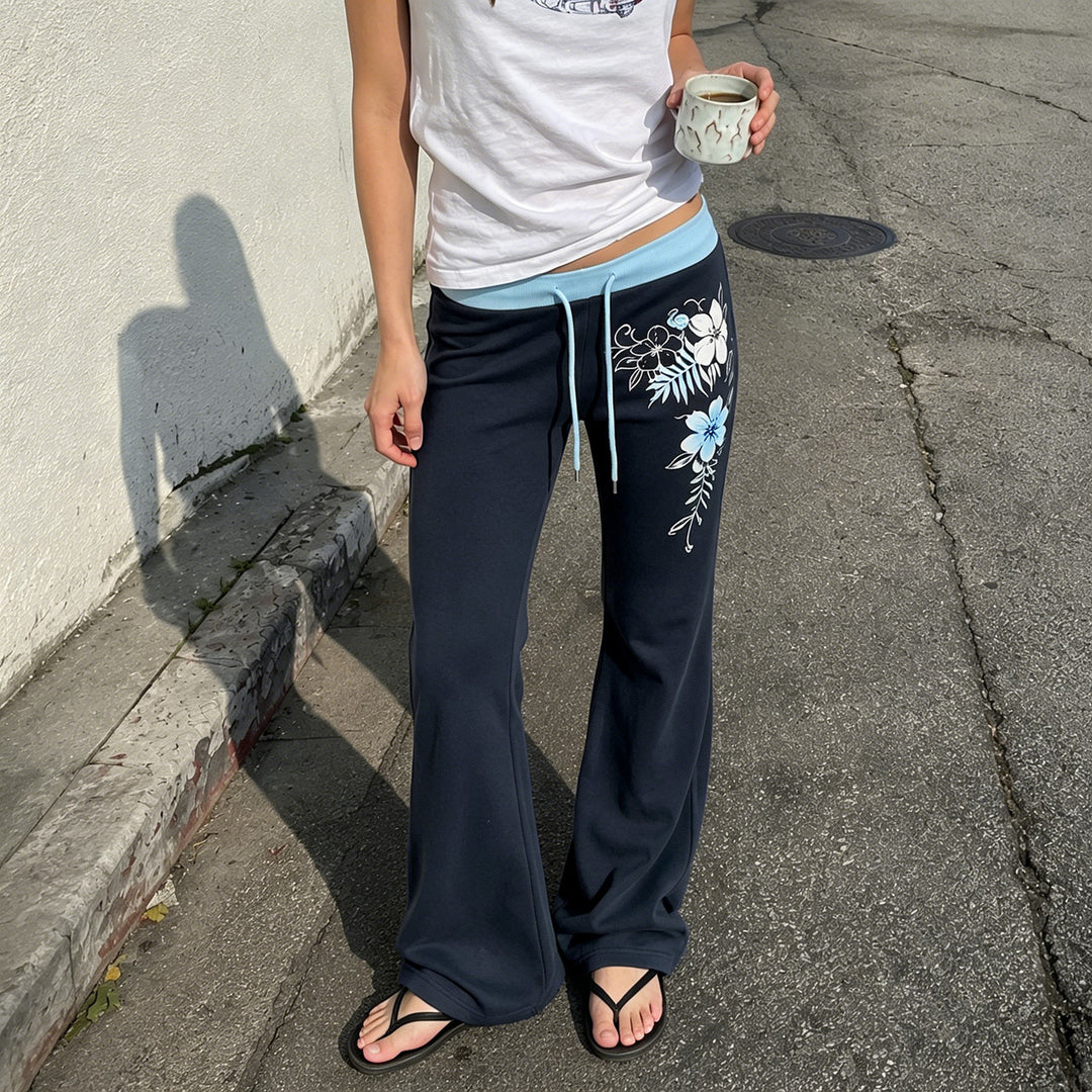 Women’s flared lounge pants with high stretch waistband, drawstring and floral print Mune Fashion