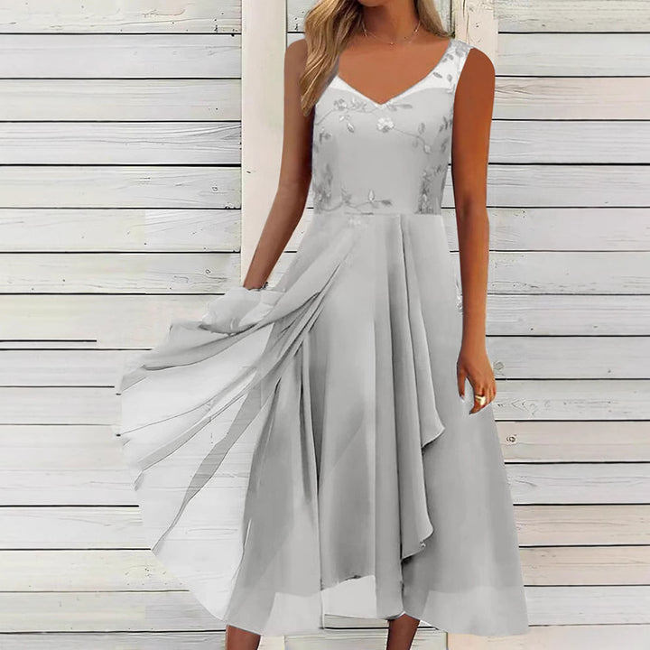 Women A-line chiffon dress with floral embroidered bodice, V-neck, draped godet swing and concealed side pockets Mune Fashion