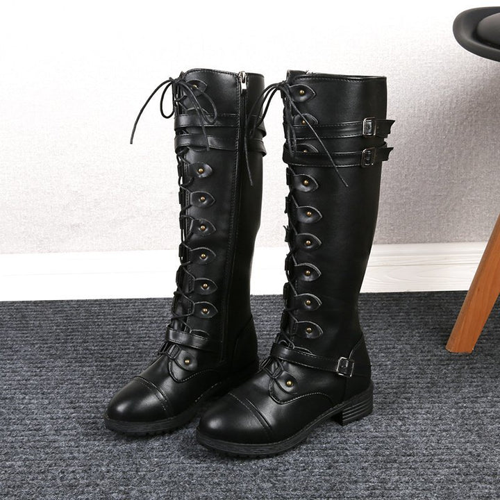 Women knee-high lace-up boots with side zipper, adjustable decorative straps and patterned rubber sole Mune Fashion