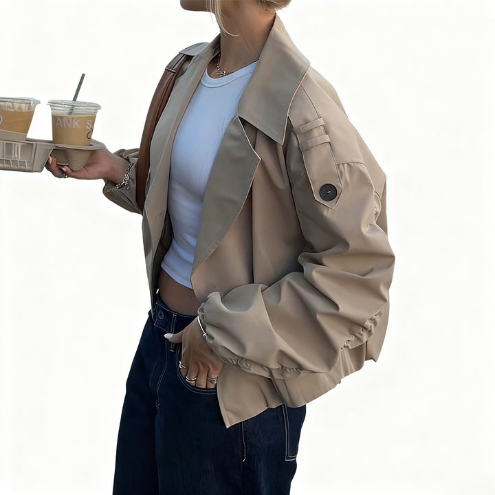 Women's shortened trench coat with double-breasted front, wide lapels, and elastic cuffs Mune Fashion