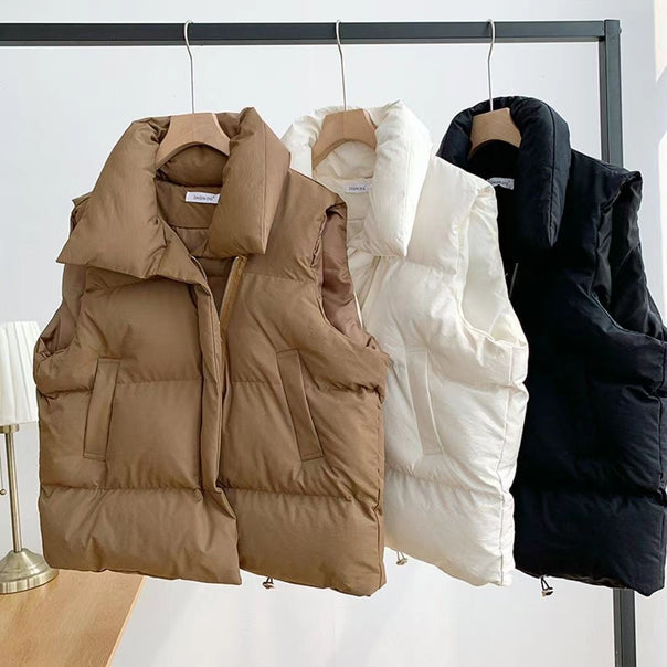 Women's short padded quilted vest with high shawl collar and adjustable drawstring hem Mune Fashion