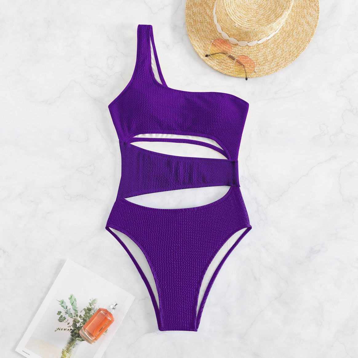 Women’s one-piece swimsuit with asymmetric design and trendy cut-outs Mune Fashion