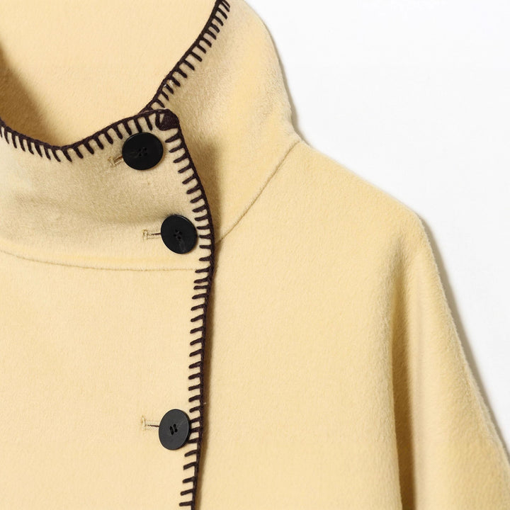 Women's cape coat with stand-up collar, asymmetric button placket and decorative seam Mune Fashion