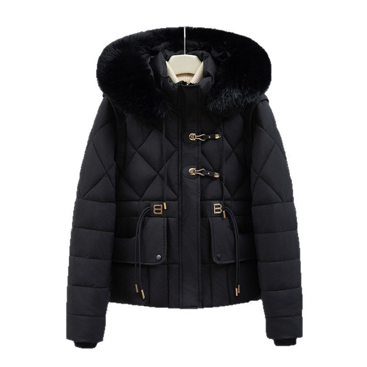 Women's short quilted hooded jacket with voluminous faux fur trim, drawstring waist, and flap pockets Mune Fashion
