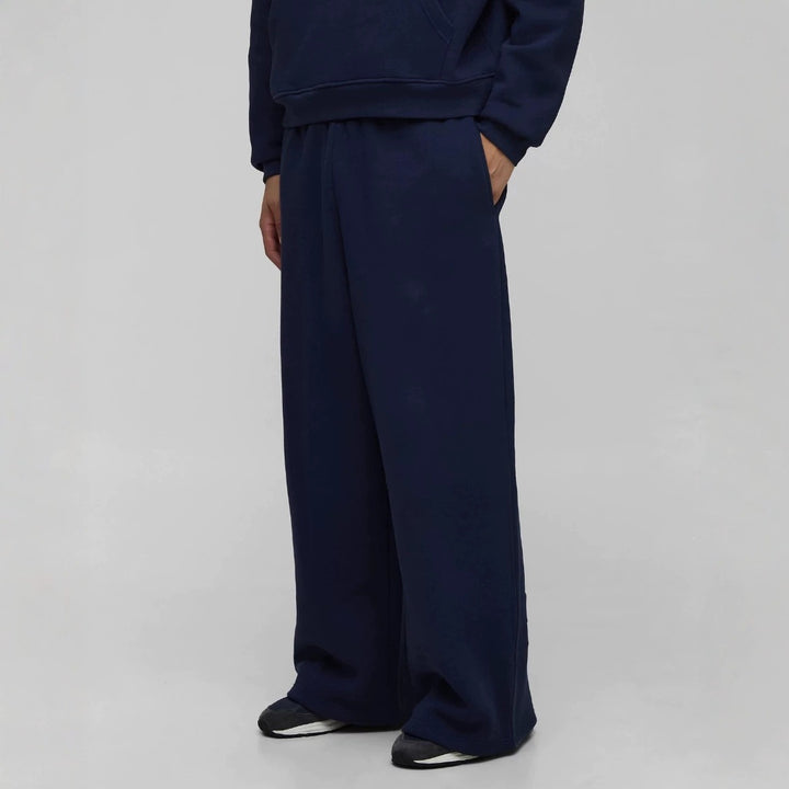 Unisex non-padded sweatpants with elastic comfort waistband, straight leg and side pockets Mune Fashion