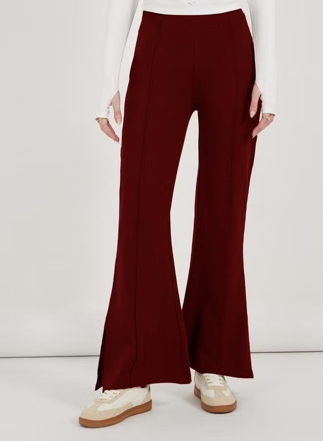 Women’s flared pants with high waist, continuous crease and side hem slit Drune