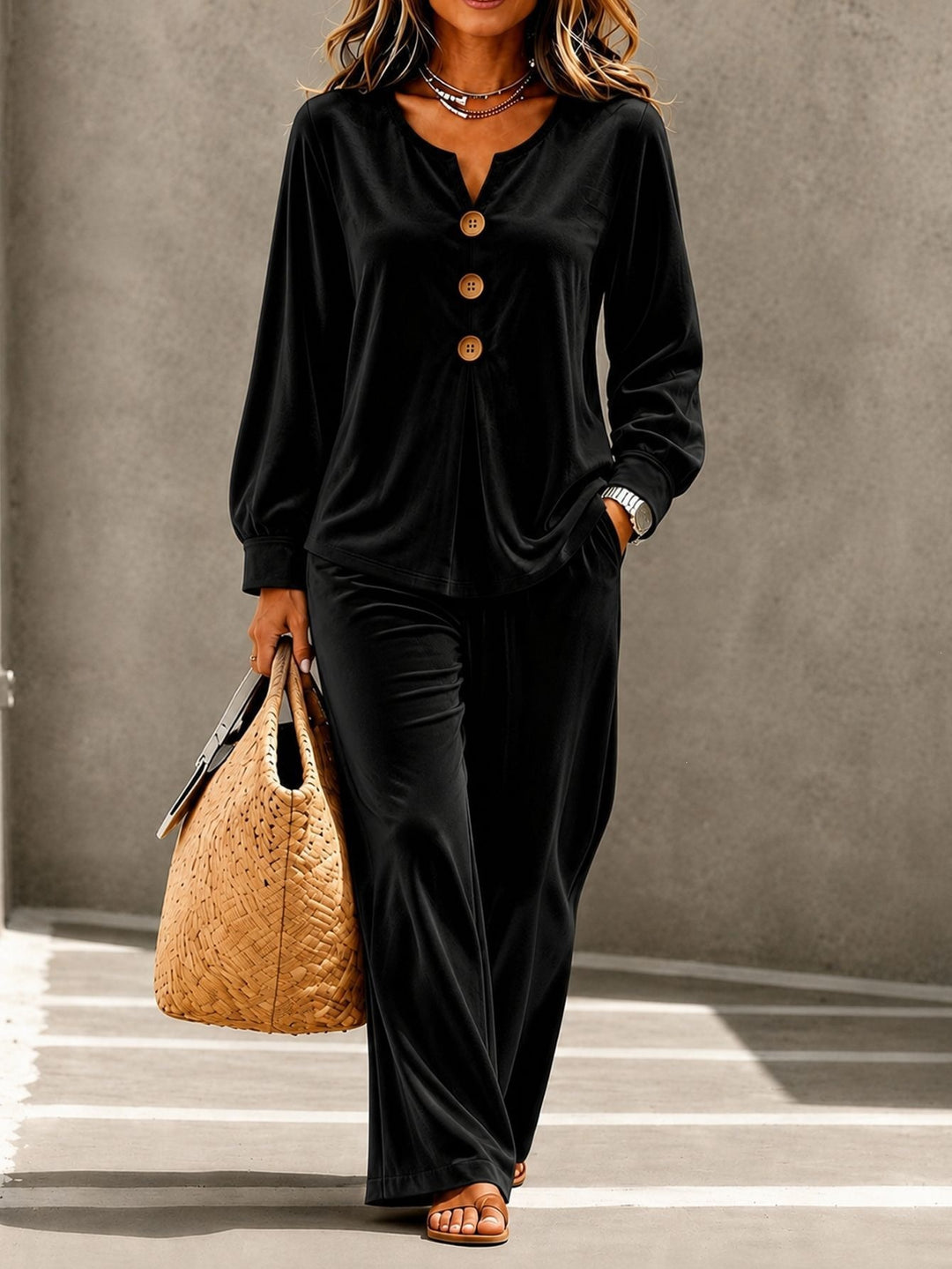 Women in soft velvet lounge set with V-neck, button placket, and wide leg Mune Fashion