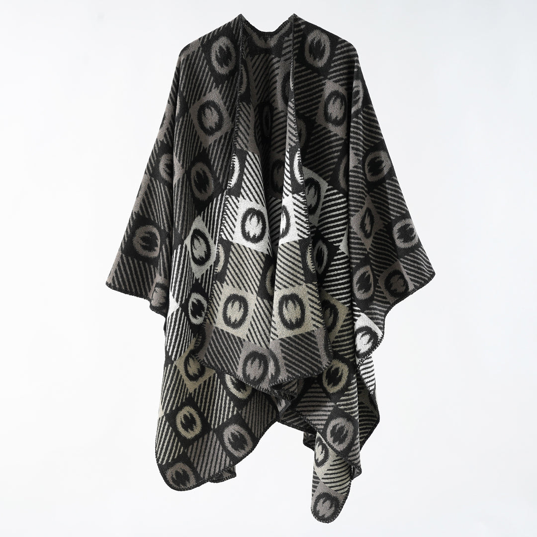 Women's jacquard wrap poncho made of fine knit with graphic circle jacquard and open kimono silhouette.