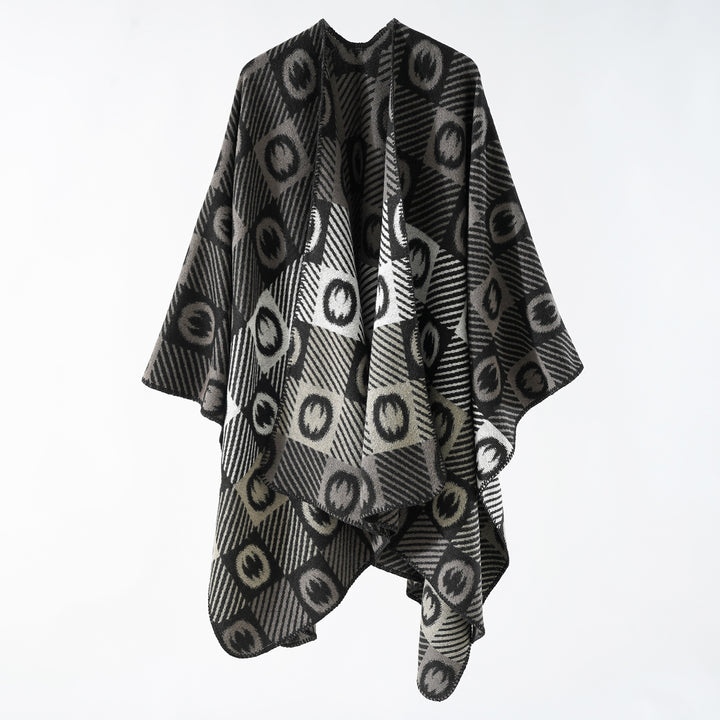 Women's jacquard wrap poncho made of fine knit with graphic circle jacquard and open kimono silhouette.