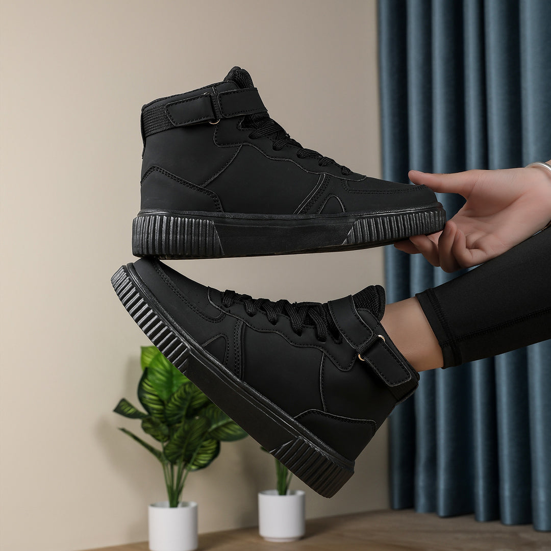 Women’s ankle-high polyurethane leather casual shoe with Velcro cuff, perforated toe cap, and textured rubber sole Mune Fashion
