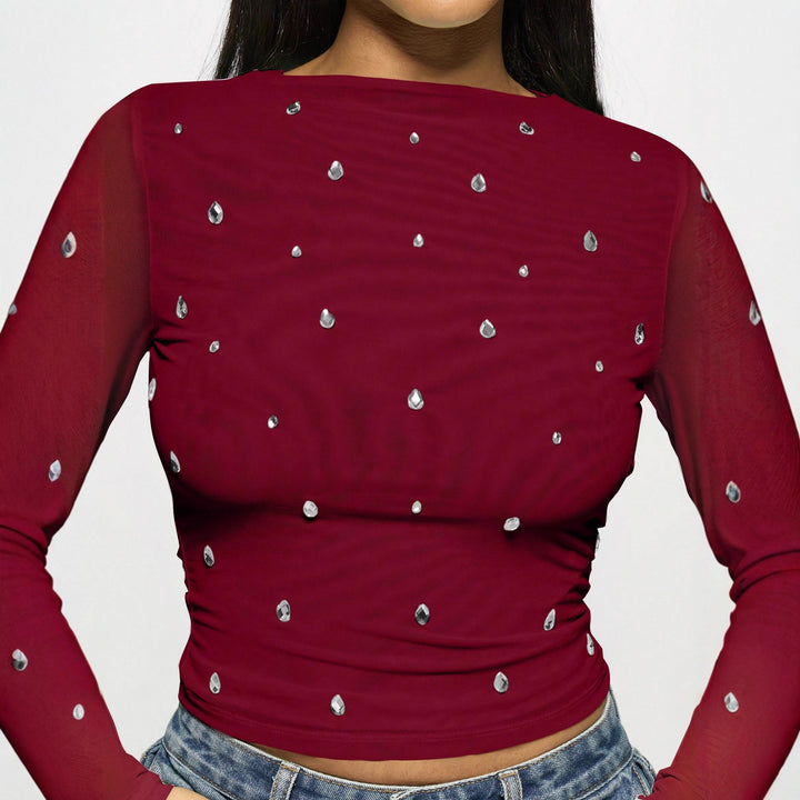 Women's fitted mesh top with rhinestone applications and boat neck Mune Fashion