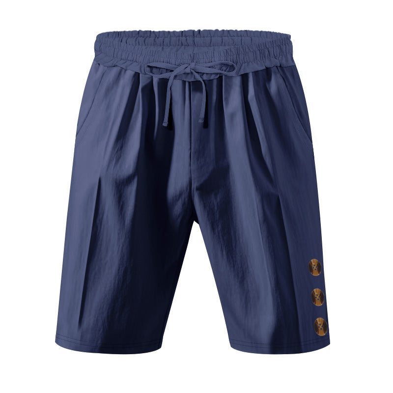 Men's knee-length casual Bermuda shorts with elastic tunnel drawstring waist, side slit pockets, and round decorative appliqués Mune Fashion